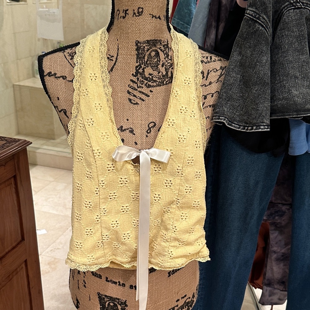 Butter yellow V neck halter top, backless with front satin bow. Urban Outfitter